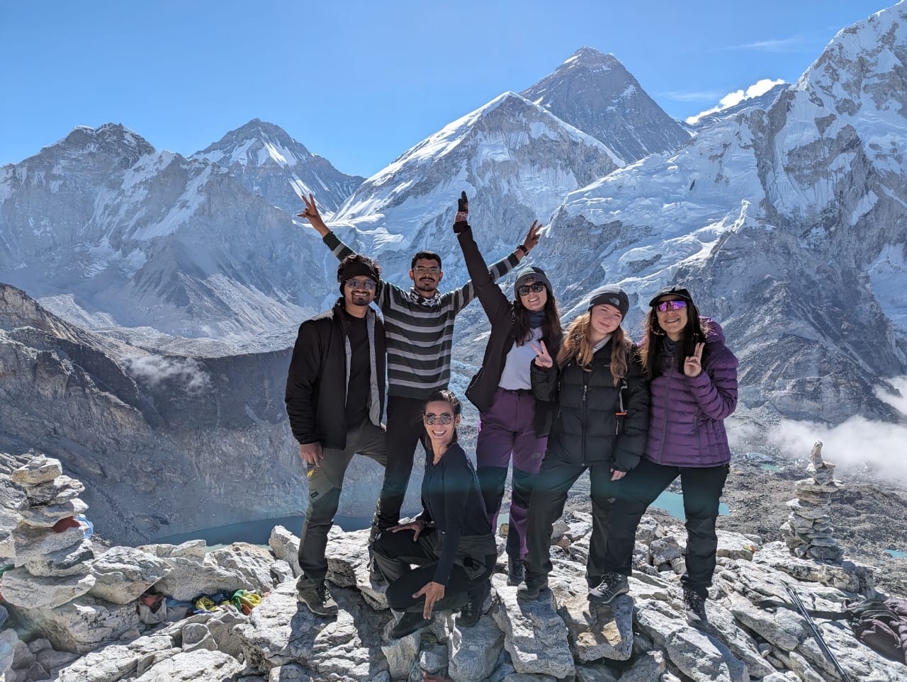 Happy HoneyGuide trekkers on top of Kala Patthar